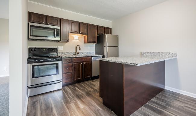 open kitchen with wall attached counter